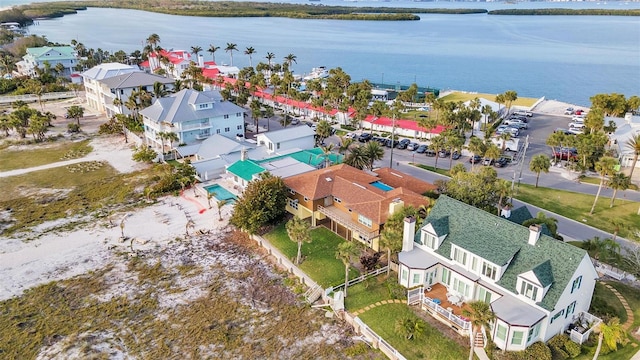 drone / aerial view with a water view and a residential view