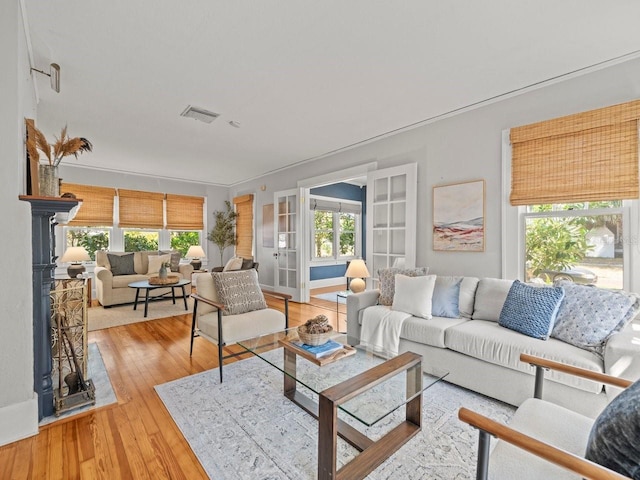 living area featuring visible vents and light wood-type flooring