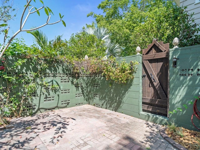 view of patio / terrace featuring a gate and fence