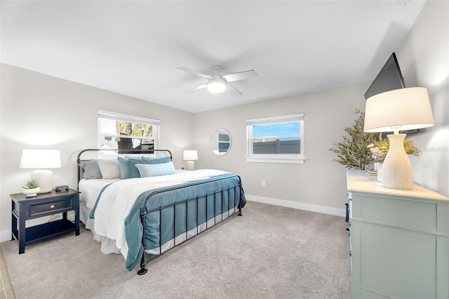 1015 Spindle Palm Way, Apollo Beach, FL 33572 - bedroom with a ceiling fan, baseboards, multiple windows, and light carpet