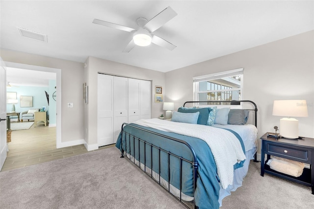 1015 Spindle Palm Way, Apollo Beach, FL 33572 - bedroom with a closet, visible vents, baseboards, a ceiling fan, and carpet