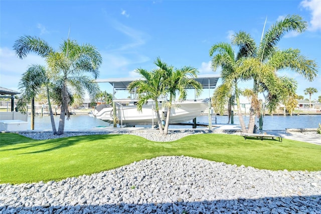 1015 Spindle Palm Way, Apollo Beach, FL 33572 - view of community featuring a lawn, a boat dock, boat lift, and a water view