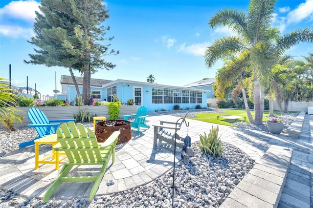 1015 Spindle Palm Way, Apollo Beach, FL 33572 - view of patio featuring fence and an outdoor fire pit