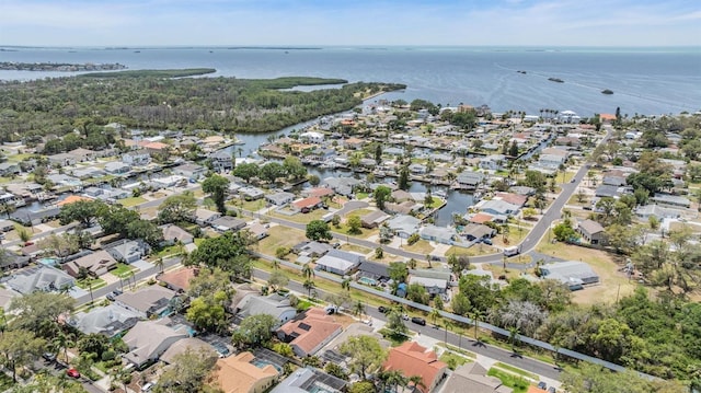 bird's eye view featuring a water view and a residential view