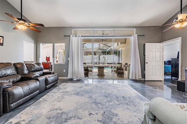 living room with ceiling fan, a textured ceiling, and vaulted ceiling
