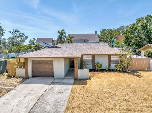 single story home featuring fence, a shingled roof, and a garage