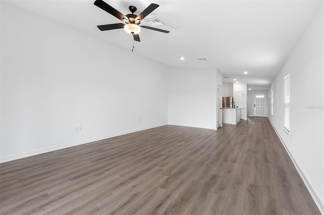 124 Hallam Ct, Spring Hill, FL 34606 - unfurnished living room with visible vents, baseboards, recessed lighting, a ceiling fan, and wood finished floors