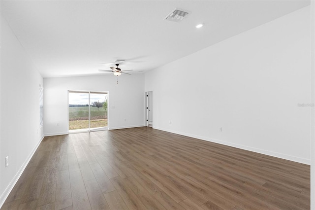 124 Hallam Ct, Spring Hill, FL 34606 - unfurnished living room with baseboards, a ceiling fan, visible vents, and dark wood-type flooring