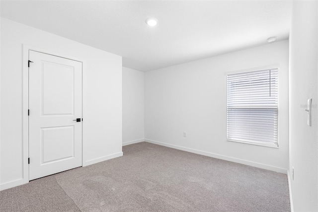 124 Hallam Ct, Spring Hill, FL 34606 - carpeted empty room featuring baseboards