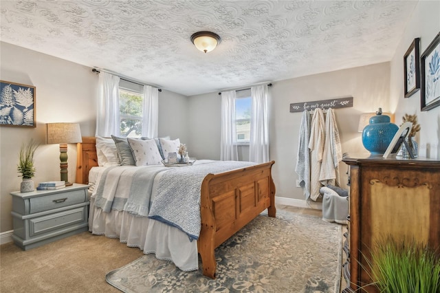 bedroom featuring a textured ceiling and baseboards