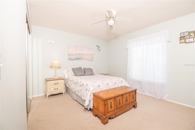 7812 Turnbridge Dr, Port Richey, FL 34668 - bedroom with light colored carpet, baseboards, and ceiling fan