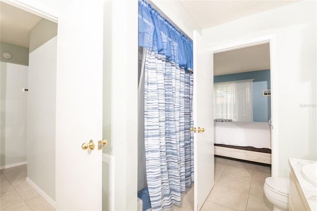 7812 Turnbridge Dr, Port Richey, FL 34668 - full bath featuring connected bathroom, tile patterned floors, toilet, and vanity