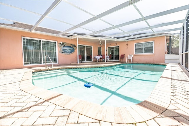 7812 Turnbridge Dr, Port Richey, FL 34668 - swimming pool featuring a patio, a ceiling fan, and glass enclosure