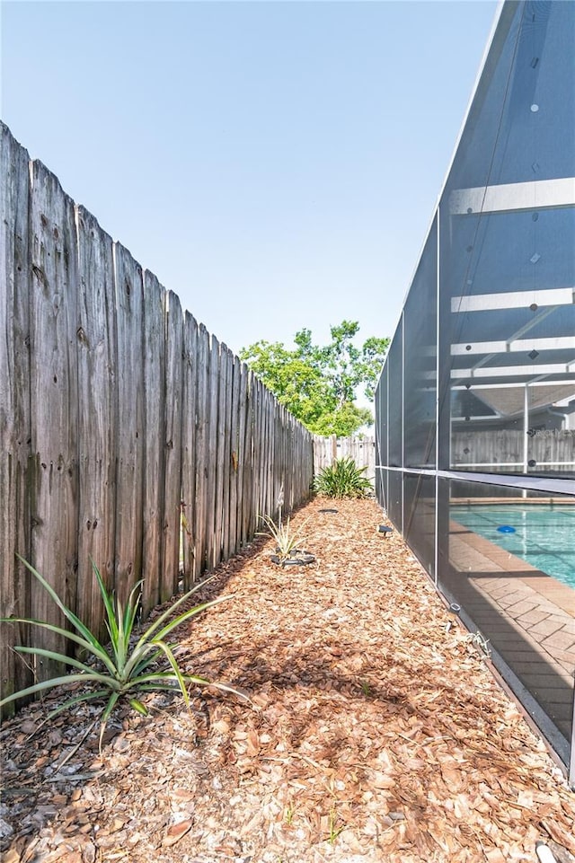 7812 Turnbridge Dr, Port Richey, FL 34668 - fenced backyard with glass enclosure
