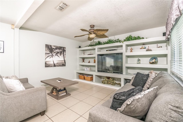7812 Turnbridge Dr, Port Richey, FL 34668 - living room with light tile patterned flooring, ceiling fan, and a textured ceiling