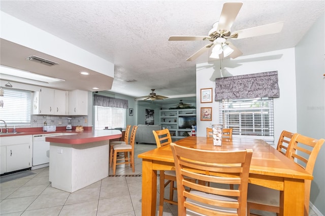 7812 Turnbridge Dr, Port Richey, FL 34668 - dining area with a ceiling fan, a textured ceiling, light tile patterned floors, and recessed lighting
