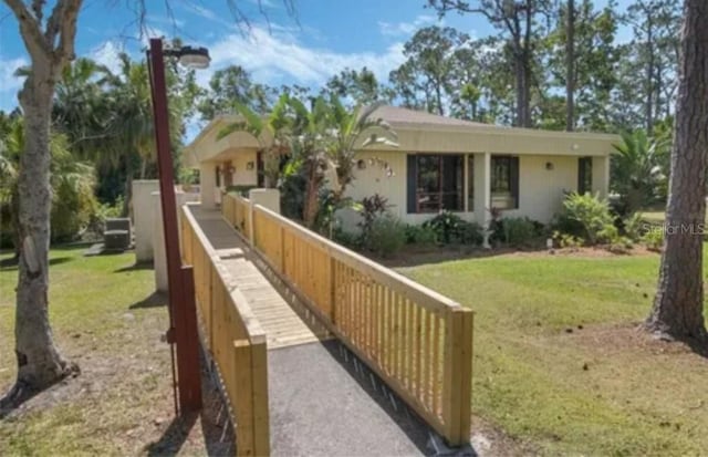 view of side of property featuring a lawn