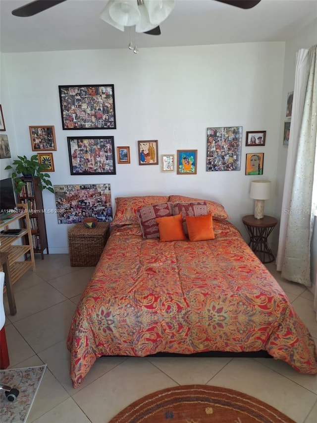 bedroom featuring tile patterned flooring and a ceiling fan