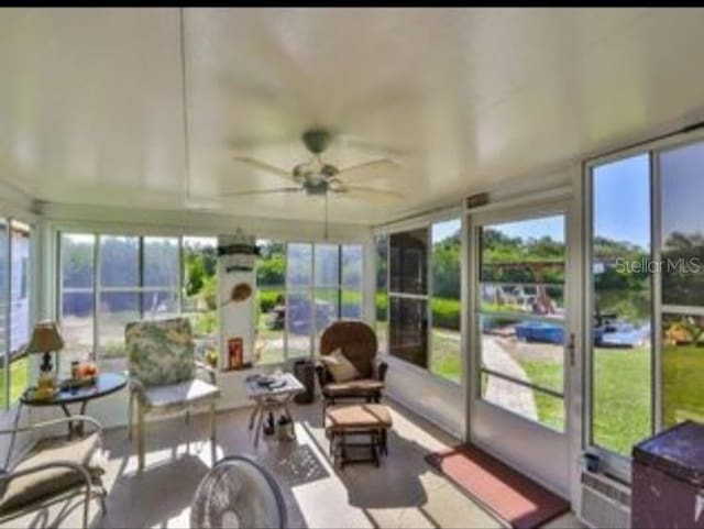 sunroom / solarium featuring plenty of natural light
