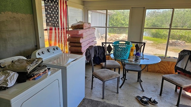 sunroom / solarium featuring washing machine and clothes dryer