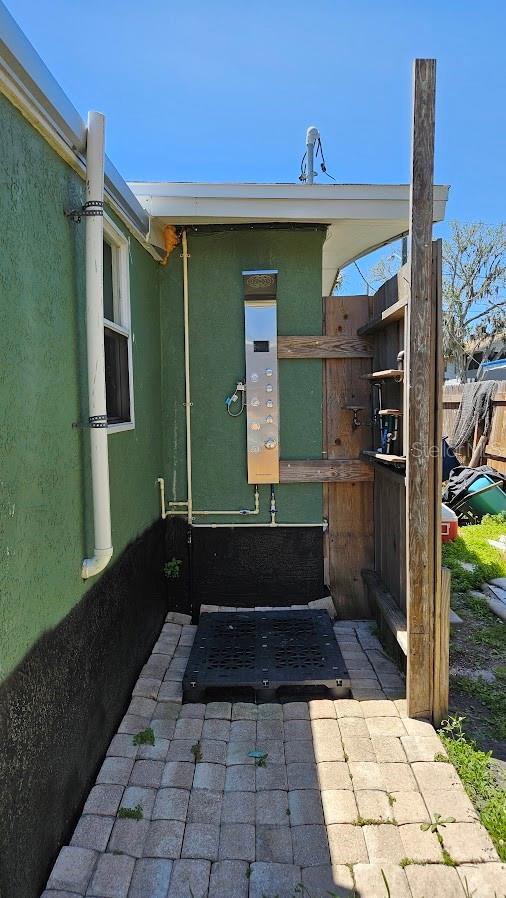 view of exterior entry with stucco siding