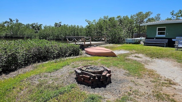 6904 11th Ave E, Palmetto, FL 34221 - view of yard featuring an outdoor fire pit