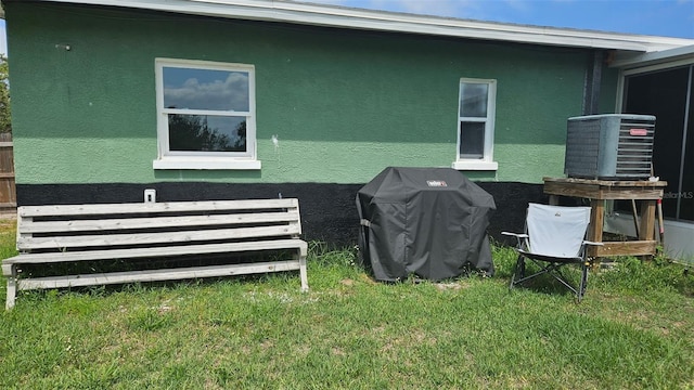 6904 11th Ave E, Palmetto, FL 34221 - view of property exterior with a yard and stucco siding