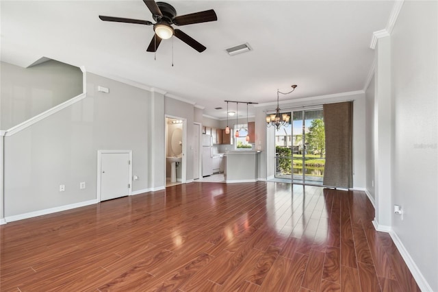 unfurnished living room featuring crown molding, visible vents, baseboards, dark wood-type flooring, and ceiling fan with notable chandelier