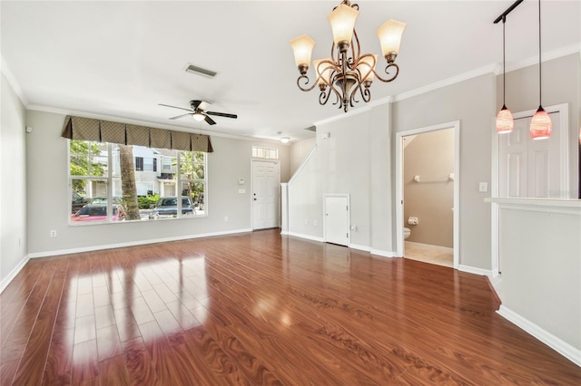 unfurnished living room featuring wood finished floors, crown molding, and ceiling fan with notable chandelier