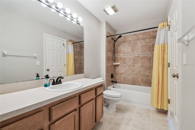 bathroom featuring visible vents, shower / bath combo with shower curtain, toilet, vanity, and tile patterned flooring