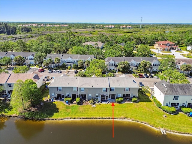 bird's eye view featuring a residential view and a water view