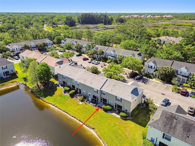 bird's eye view featuring a residential view and a water view