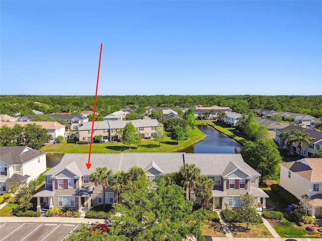 bird's eye view featuring a residential view and a water view