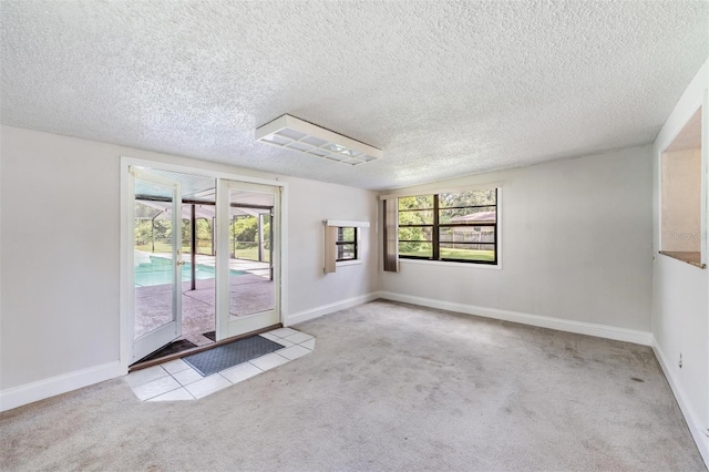15808 Willowdale Rd, Tampa, FL 33625 - carpeted spare room featuring a textured ceiling