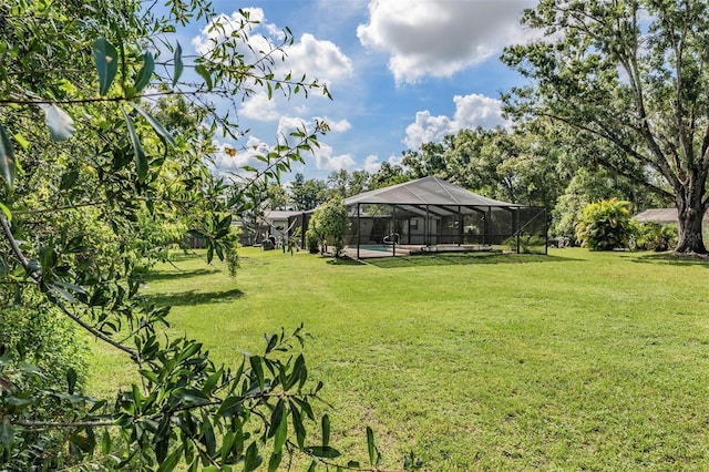 15808 Willowdale Rd, Tampa, FL 33625 - view of grassy yard with an outdoor pool and a lanai