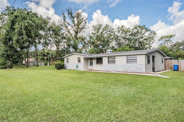 15808 Willowdale Rd, Tampa, FL 33625 - rear view of property featuring stucco siding and stone siding