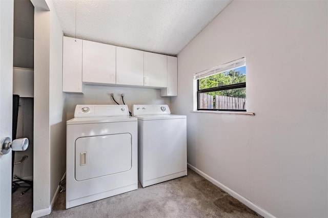 15808 Willowdale Rd, Tampa, FL 33625 - laundry area featuring washer and dryer, light carpet, cabinet space, and a textured ceiling
