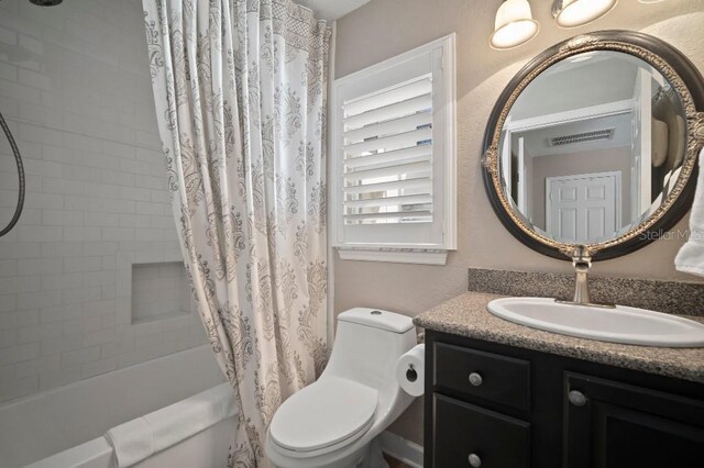 bathroom featuring visible vents, shower / bath combination with curtain, toilet, and vanity