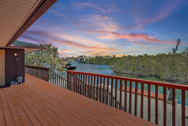 wooden deck with a water view
