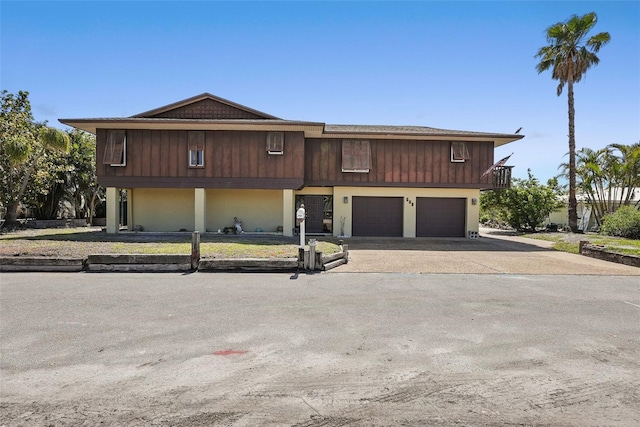 view of front of house with an attached garage and driveway