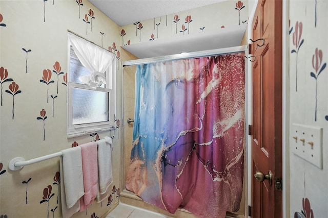 bathroom featuring tile patterned flooring and a shower with curtain