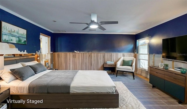4511 Huntington St NE, Saint Petersburg, FL 33703 - bedroom with wainscoting, crown molding, wood finished floors, and a ceiling fan