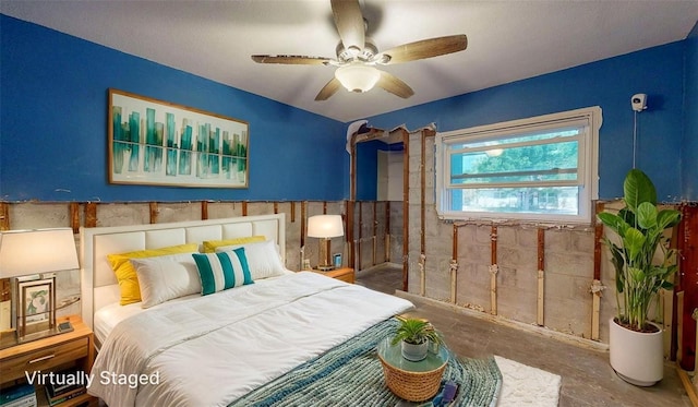4511 Huntington St NE, Saint Petersburg, FL 33703 - bedroom with wainscoting, unfinished concrete flooring, and a ceiling fan