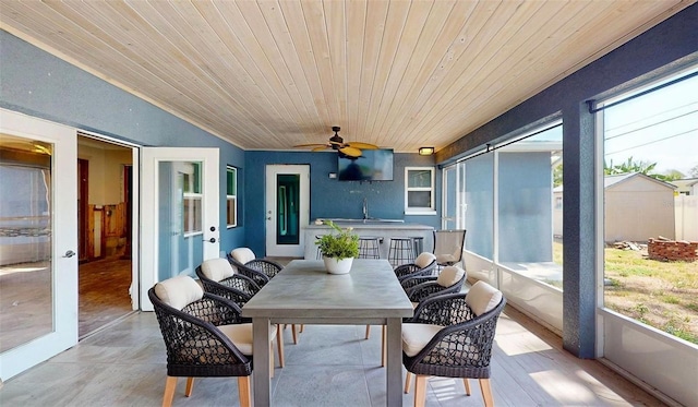 4511 Huntington St NE, Saint Petersburg, FL 33703 - sunroom featuring outdoor dining space and a ceiling fan