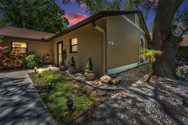 view of front facade featuring stucco siding