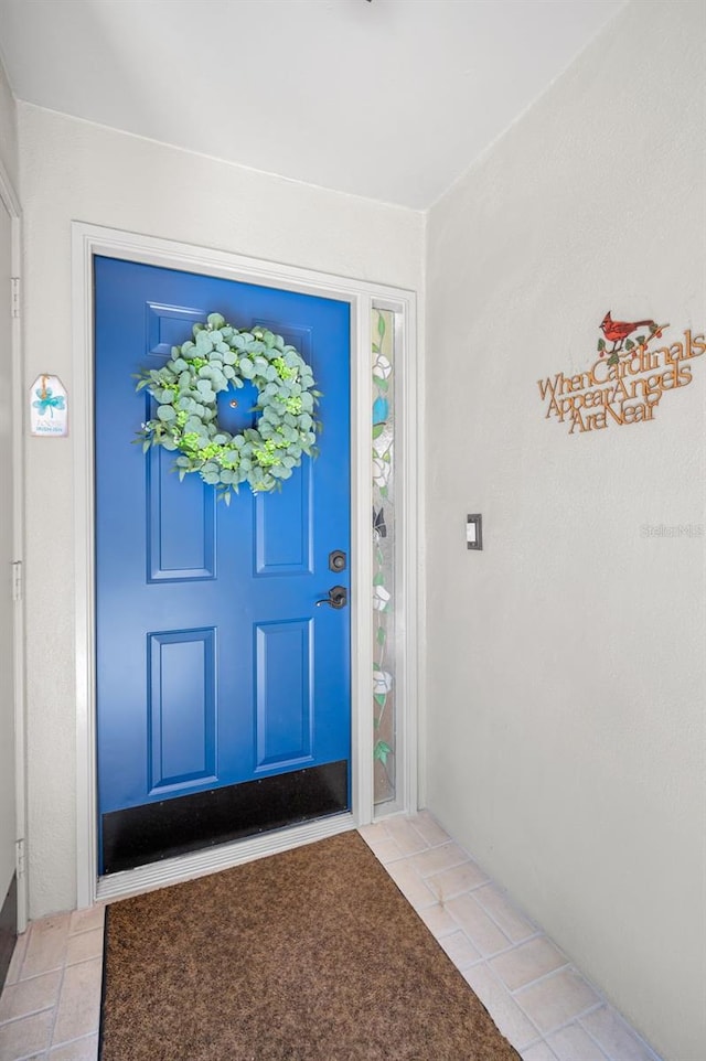 doorway to property with stucco siding