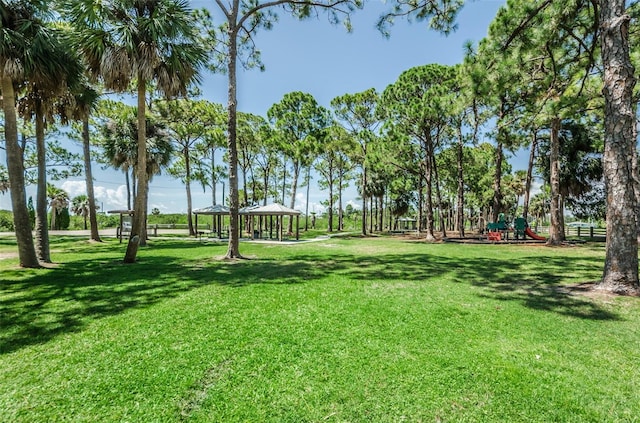 view of home's community with a gazebo, a yard, and playground community