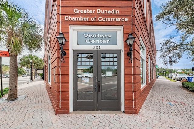 view of exterior entry featuring french doors