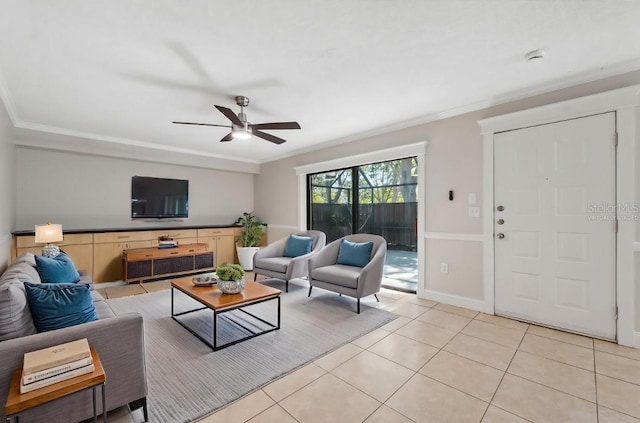 living area featuring ornamental molding, ceiling fan, and light tile patterned floors