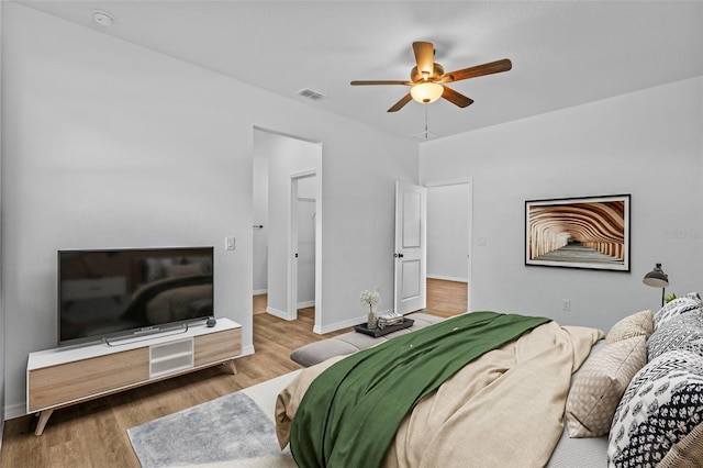 7603 Rhode Island Dr, Tampa, FL 33619 - bedroom with wood finished floors, visible vents, a ceiling fan, and baseboards